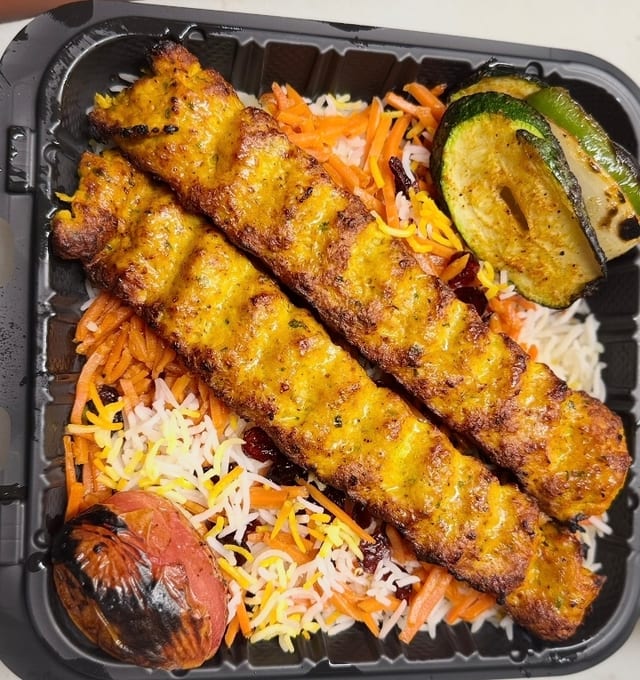 Chicken Seekh with seasoned rice.
